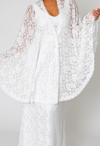 closeup-view-white-lace-wedding-gown-with-cape