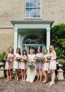 bohemian-bride-poppy-photographed-with-her-bridesmaids-wearing-mismatched-dress