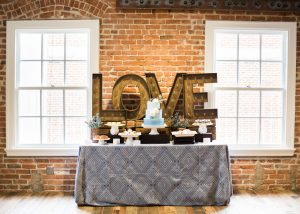 dessert-table-with-bronze-love-sign