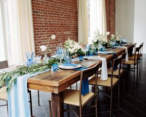reception-table-decor-for-rustic-style-wedding-bare-wood-tables-with-greenery