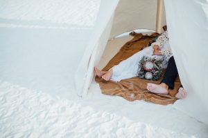 bohemian-bride-and-groom-in-teepee-in-whitesands-national-park