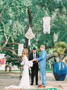 boho-bride-wearing-off-shoulder-lace-wedding-dress-with-bell-eleeves-in-her-backyard-bohemian-wedding