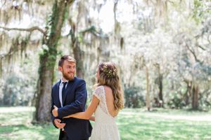 a-groom-sees-his-bride-for-the-first-time-at-their-bohemian-wedding