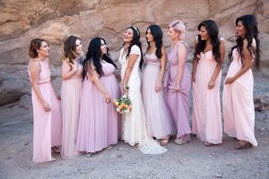 bohemian-wedding-party-bridesmaids-in-pink-dresses-bride-in-boho-lace-dress