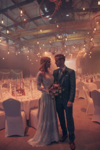 bride-and-groom-poised-in-a-magical-setting-of-twinkle-lights-in-iceland-boho-wedding-inspo