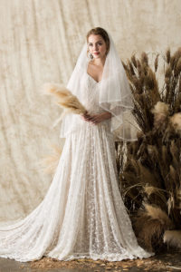 a-bohemian-simple-lace-wedding-dress-shown-with-elbow-length-blusher-veil