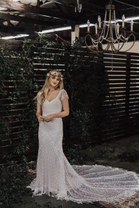 Jenny-multi-dimensional-paneled-dotted-and-floral-boho-wedding-dress-with-loads-of-fringe