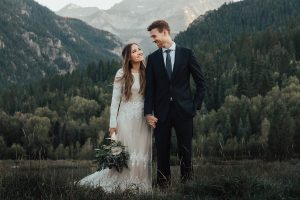 real-bride-in-Utah-mountains-wearing-lisa-long-sleeve-modest-wedding-dress