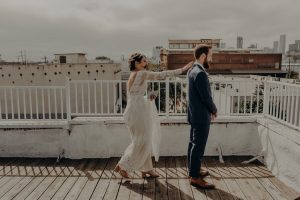 an-intimate-warehouse-wedding-at-the-unique-space-in-downtown-los-angeles-here-the-couples-first-look