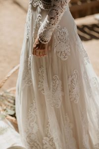 close-up-detailing-of-Isabella-applique-mesh-lace-gown-and-scalloped-hem