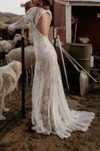 Willow-lace-wedding-dress-with-long-sleeves-cutout-open-back-and-long-train-made-in-California