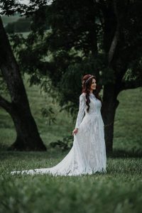 Bride-wearing-Simone-gown-with-long-sleeves-and-flowy-skirt