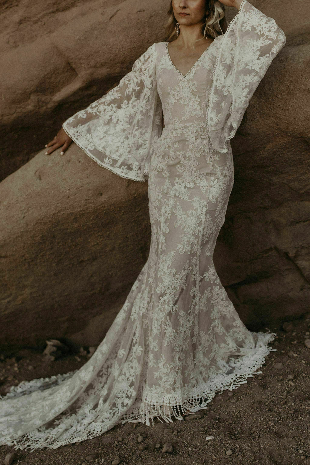 Back of cream and lace wedding dress showing the corset back and