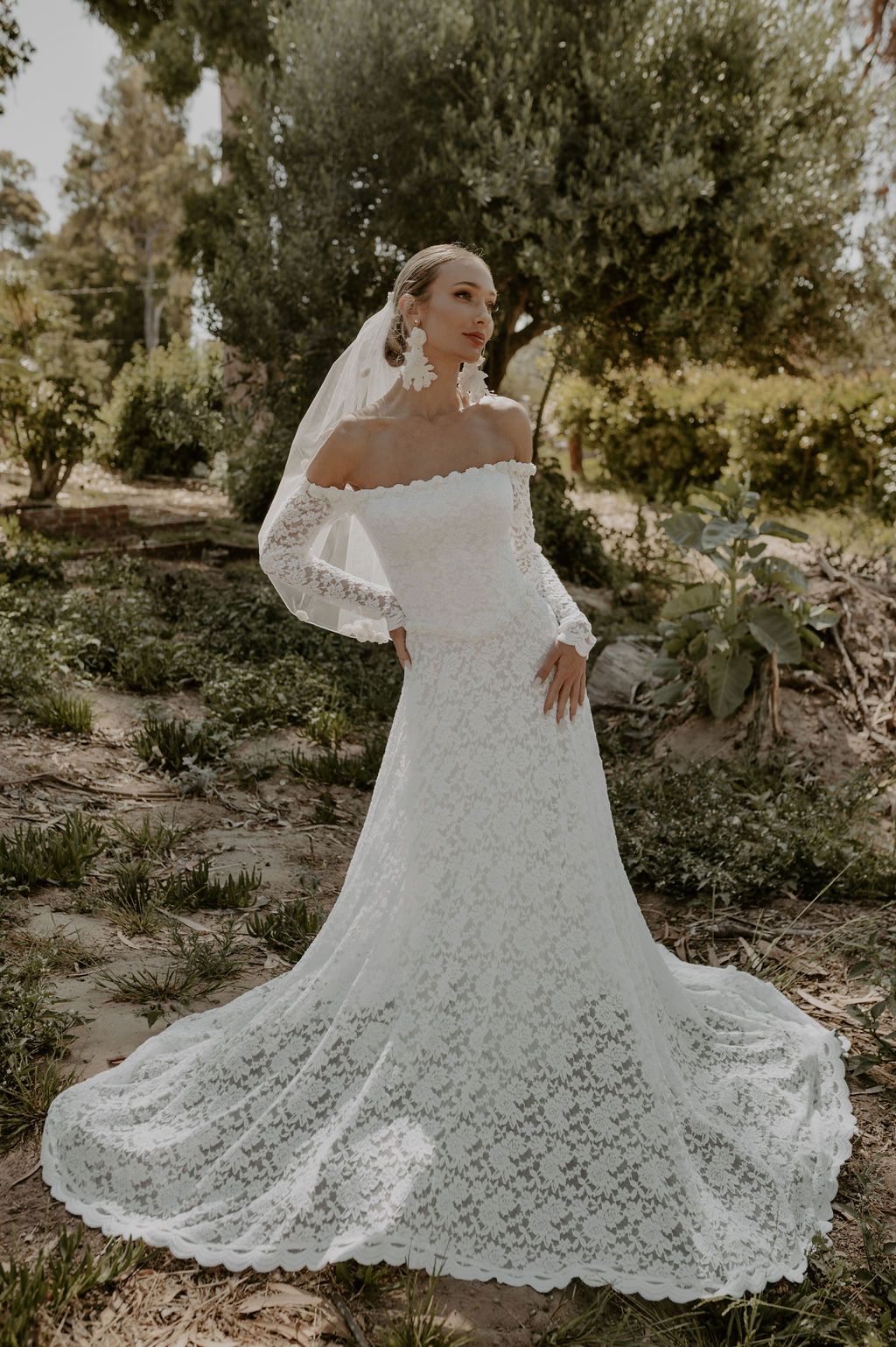 https://www.dreamersandlovers.com/wp-content/uploads/2023/09/Fiona-Long-Sleeve-Off-Shoulder-Lace-Wedding-Dress.jpeg