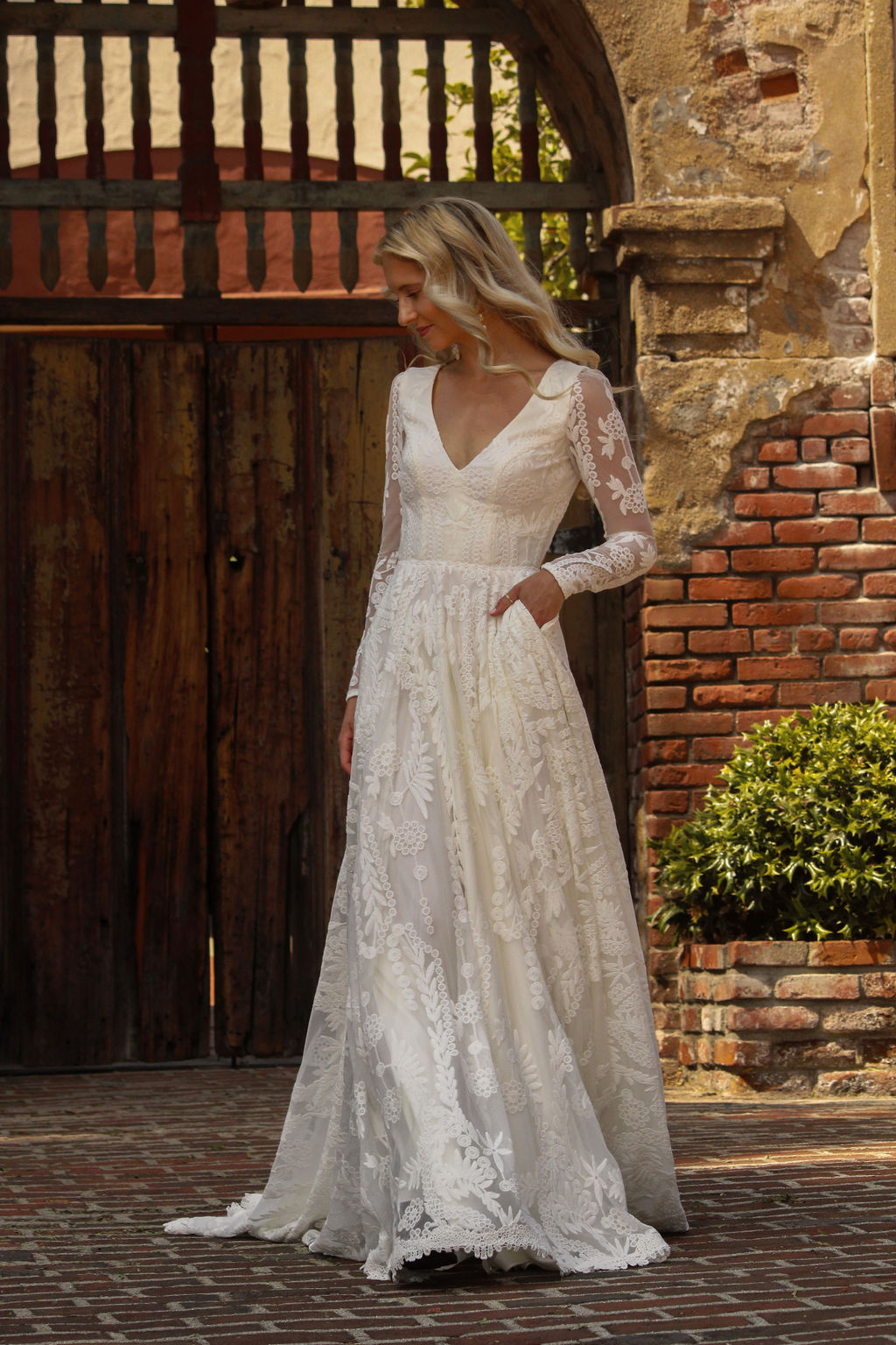 Discover-the-River-lace-wedding-dress-fitted-sleeves-open-back-and-flowy-skirt